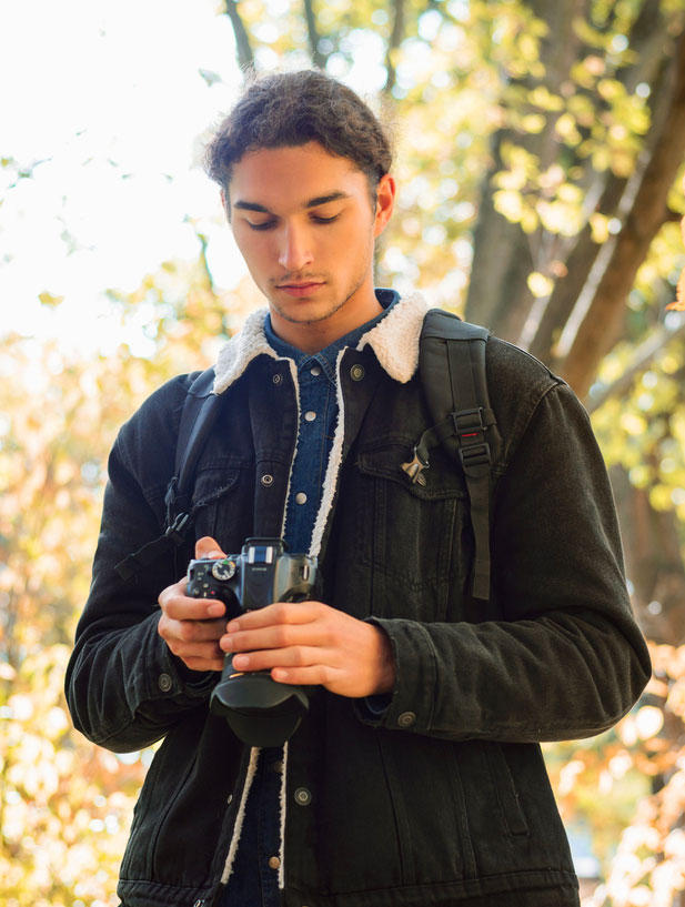 photographer looking into digital camera