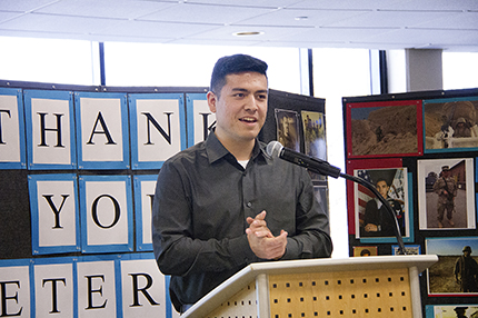 Kelly Gampel WCC student and Petty Officer Second Class JT Iacovetta, a Navy veteran, speaks to the crowd gathered for Washtenaw Community College’s Veterans Day ceremony on Nov. 8.