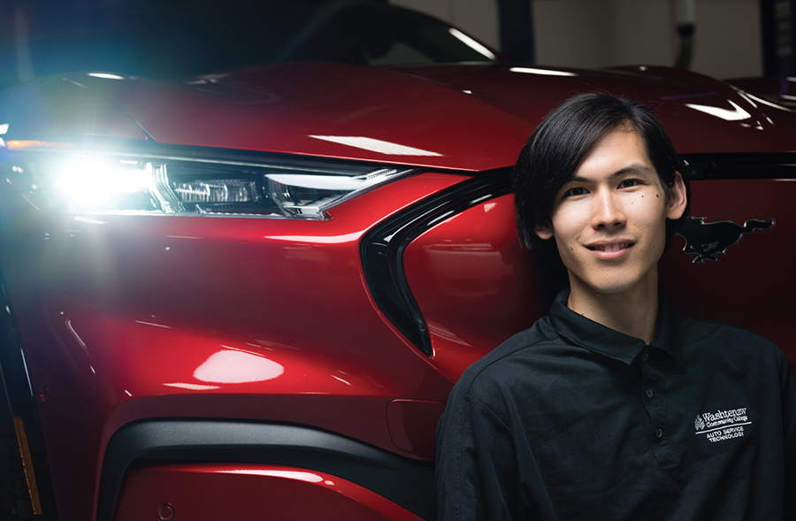 Alex Spencer in front of Mustang Mach-E